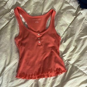 Coral tank top buttons and ruffled bottom